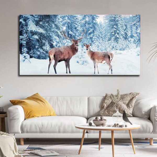 Family of noble deer in a snowy winter forest at sunset Canvas